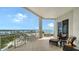 Spacious balcony featuring comfortable seating and stunning panoramic views of the bay and coastline at 2050 Benjamin Franklin Dr # A1001, Sarasota, FL 34236
