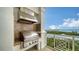 Outdoor kitchen space on the balcony featuring a stainless steel grill and stunning views of the bay at 2050 Benjamin Franklin Dr # A1001, Sarasota, FL 34236
