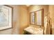 Neat half bathroom featuring decorative mirror, sink and a tropical wallpaper design at 2050 Benjamin Franklin Dr # A1001, Sarasota, FL 34236