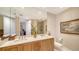 Elegant bathroom with double sinks, marble countertops, a large mirror and beautiful decor at 2050 Benjamin Franklin Dr # A1001, Sarasota, FL 34236