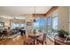 A bright dining area features a round table with seating for four and stunning water views at 2050 Benjamin Franklin Dr # A1001, Sarasota, FL 34236