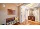 Elegant foyer with wood floors, decorative walls, and a stylish bench, creating a welcoming entrance at 2050 Benjamin Franklin Dr # A1001, Sarasota, FL 34236