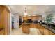 Well-equipped kitchen with custom cabinets, black countertops, and an open layout at 2050 Benjamin Franklin Dr # A1001, Sarasota, FL 34236