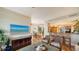 Open-concept design with a living area, dining space, and kitchen with bar seating at 2050 Benjamin Franklin Dr # A1001, Sarasota, FL 34236