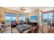 An elegant living room boasts water views, comfortable seating, and natural light at 2050 Benjamin Franklin Dr # A1001, Sarasota, FL 34236