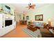Cozy living room features comfortable seating, a decorative ceiling fan and light, and a beachy theme at 2050 Benjamin Franklin Dr # A1001, Sarasota, FL 34236