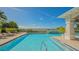 Beautiful pool area with lounge chairs and ocean views on a bright, sunny day at 2050 Benjamin Franklin Dr # A1001, Sarasota, FL 34236