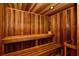 Inviting sauna featuring warm wood paneling, comfortable seating, and overhead lighting at 2050 Benjamin Franklin Dr # A1001, Sarasota, FL 34236