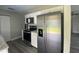 Bright kitchen featuring stainless steel appliances, granite countertops, and white cabinets at 21114 Gladis Ave, Port Charlotte, FL 33952
