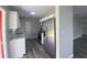 Bright kitchen with stainless steel appliances, granite countertops, and white cabinets at 21114 Gladis Ave, Port Charlotte, FL 33952