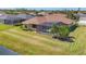 Aerial view of a home featuring a screened-in pool, landscaping, and well-maintained lawn at 2281 Vintage St, Sarasota, FL 34240
