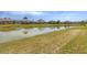 This property features a serene waterfront backyard and lush green grass at 2281 Vintage St, Sarasota, FL 34240