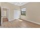 This bedroom features light wood floors, a double closet, and a window for natural light at 2281 Vintage St, Sarasota, FL 34240