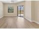 Bright bedroom with sliding glass door and pool view, perfect for relaxation and enjoying the outdoors from inside at 2281 Vintage St, Sarasota, FL 34240