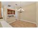 Sunlit dining room featuring elegant chandelier and easy access to kitchen, ideal for Gathering meals and gatherings at 2281 Vintage St, Sarasota, FL 34240