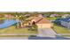 Beautiful single-story home with a well-manicured lawn, a colorful front garden and a two car garage at 2281 Vintage St, Sarasota, FL 34240