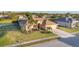 Beautiful single-story home with a well-manicured lawn, a colorful front garden and a two car garage at 2281 Vintage St, Sarasota, FL 34240