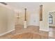 The foyer features decorative columns, an elegant chandelier, tile flooring and double entry doors at 2281 Vintage St, Sarasota, FL 34240