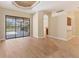 A bright living room with sliding glass doors leading to the lanai, tile flooring and an open concept floorplan at 2281 Vintage St, Sarasota, FL 34240