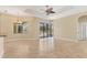 Spacious living room with tiled floors, ceiling fan, and sliding doors to patio, perfect for indoor-outdoor living at 2281 Vintage St, Sarasota, FL 34240