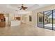 Open-concept living area with tile flooring, modern lighting, and backyard access, perfect for seamless indoor-outdoor living at 2281 Vintage St, Sarasota, FL 34240