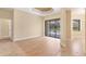 A bright living room with sliding glass doors leading to the lanai and beautiful flooring at 2281 Vintage St, Sarasota, FL 34240
