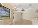 Bright living area with large window, ceiling fan, and access to backyard, ideal for enjoying natural light and serene views at 2281 Vintage St, Sarasota, FL 34240