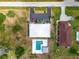 Overhead view of the property, showing the building, pool, adjacent parking, and green surroundings at 235 Rotonda W Blvd # C102, Rotonda West, FL 33947