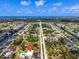 Expansive aerial view of a neighborhood with a pool and a building marked by a locator pin at 235 Rotonda W Blvd # C102, Rotonda West, FL 33947