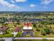 Aerial view of a community showcasing a building with a parking lot and lush surroundings at 235 Rotonda W Blvd # C102, Rotonda West, FL 33947