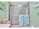 Nicely lit bathroom with a bathtub and framed sliding glass shower doors at 235 Rotonda W Blvd # C102, Rotonda West, FL 33947