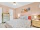 Cozy bedroom with soft lighting, queen bed, and beach themed decorations at 235 Rotonda W Blvd # C102, Rotonda West, FL 33947