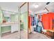 Spacious walk-in closet with built-in shelving and an adjacent vanity area at 235 Rotonda W Blvd # C102, Rotonda West, FL 33947