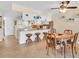 Eat-in kitchen featuring white cabinetry and turtle décor at 235 Rotonda W Blvd # C102, Rotonda West, FL 33947