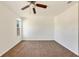 Light-filled bedroom with a modern ceiling fan and carpeted flooring at 2406 Lehigh Ave, Bradenton, FL 34207