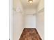 Walk-in closet featuring shelving for optimal storage space and wood-look floors at 2406 Lehigh Ave, Bradenton, FL 34207