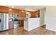Modern kitchen featuring stainless steel appliances, granite countertops, and wood cabinets at 2406 Lehigh Ave, Bradenton, FL 34207