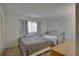 Bright bedroom with two beds, neutral paint, and carpet at 2505 Beneva Rd # 3, Sarasota, FL 34232