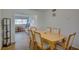 Inviting dining area with hardwood floors, connecting to the living room with natural lighting at 2505 Beneva Rd # 3, Sarasota, FL 34232