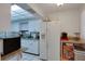 Bright kitchen with white cabinets and granite countertops, complete with modern appliances at 2505 Beneva Rd # 3, Sarasota, FL 34232