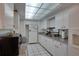 Efficient kitchen featuring white cabinets and granite countertops, with appliances at 2505 Beneva Rd # 3, Sarasota, FL 34232