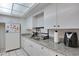 Clean kitchen with white cabinets and granite countertops, with appliances at 2505 Beneva Rd # 3, Sarasota, FL 34232