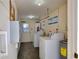 Community laundry room with washers, dryers, and utility sink at 2505 Beneva Rd # 3, Sarasota, FL 34232