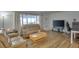 Comfortable living room with natural light, wood flooring, and sliding doors at 2505 Beneva Rd # 3, Sarasota, FL 34232