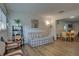 Cozy living room featuring wood floors, bright windows, and comfortable seating arrangement at 2505 Beneva Rd # 3, Sarasota, FL 34232