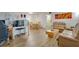 Spacious living room with wood floors and connecting to the dining area and kitchen at 2505 Beneva Rd # 3, Sarasota, FL 34232