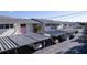 Assigned covered parking spaces for condo residents with well-kept landscaping at 2505 Beneva Rd # 3, Sarasota, FL 34232