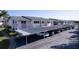 Assigned covered parking spaces with well-maintained landscaping in a condo community at 2505 Beneva Rd # 3, Sarasota, FL 34232