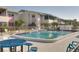 Community pool with picnic table and lounge chairs at 2505 Beneva Rd # 3, Sarasota, FL 34232