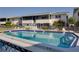 Large community pool with lounge seating and depth markers at 2505 Beneva Rd # 3, Sarasota, FL 34232